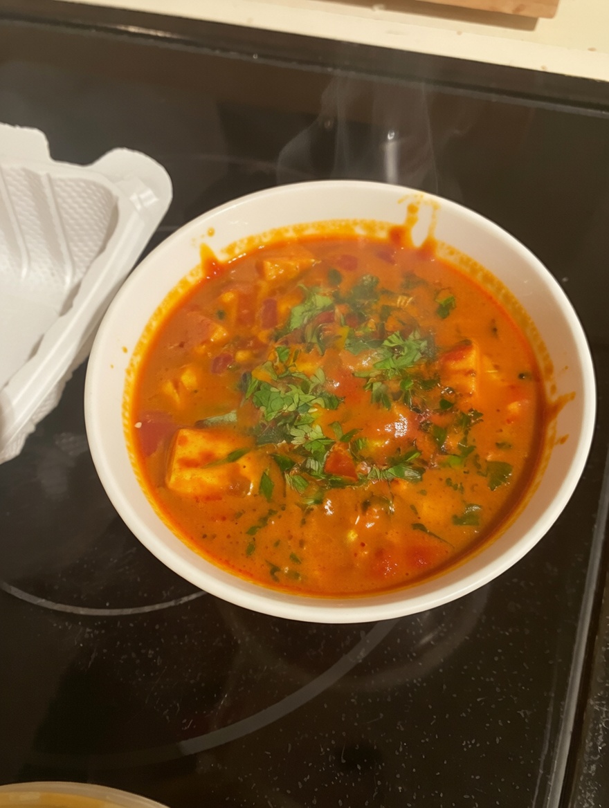 Paneer Masala — paneer cubes in a flavorful tomato-onion gravy from New Delhi Indian Restaurant